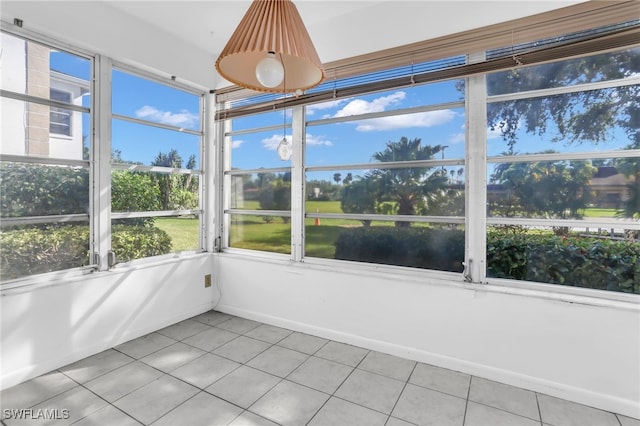 unfurnished sunroom featuring a wealth of natural light