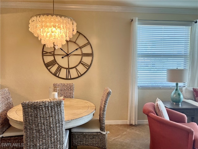 tiled dining room featuring a notable chandelier and ornamental molding