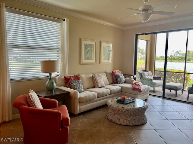 tiled living room featuring ornamental molding and ceiling fan