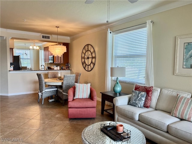 living room with sink, an inviting chandelier, tile patterned flooring, and crown molding