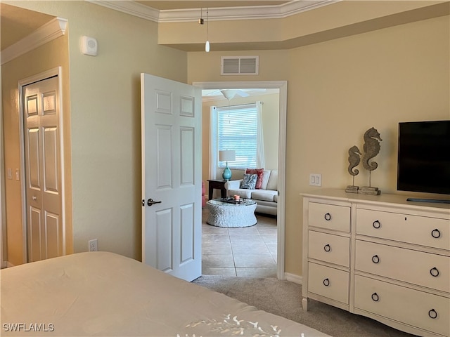 carpeted bedroom featuring crown molding