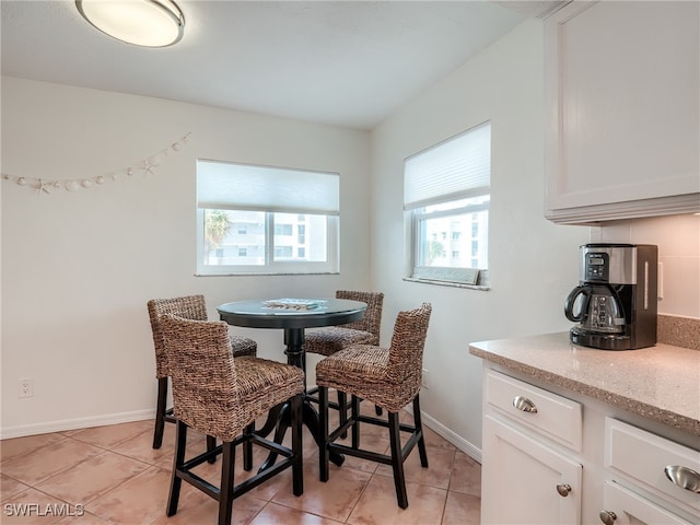 dining space with light tile patterned floors