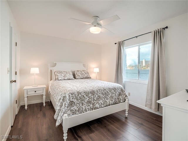 bedroom featuring ceiling fan and dark hardwood / wood-style flooring