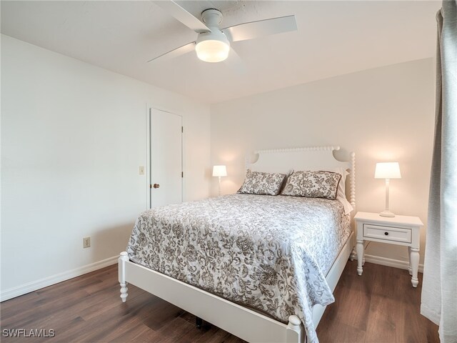 bedroom featuring ceiling fan and dark hardwood / wood-style floors