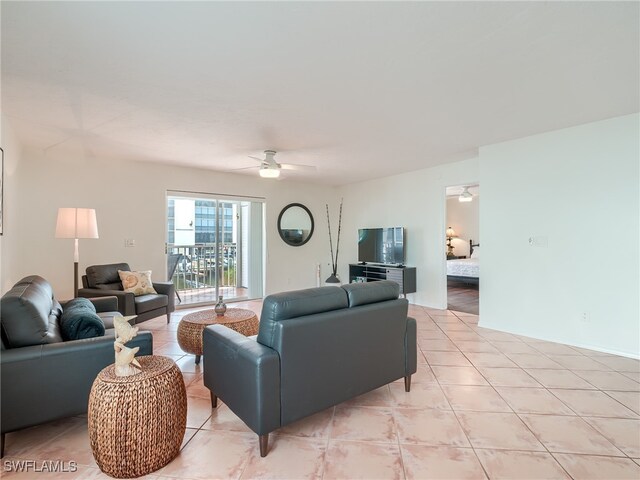 tiled living room featuring ceiling fan