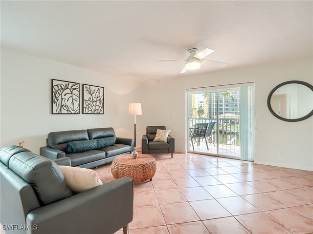 tiled living room with ceiling fan