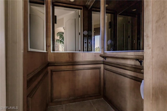 details featuring ornamental molding and tile patterned floors