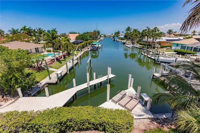 view of dock featuring a swimming pool and a water view