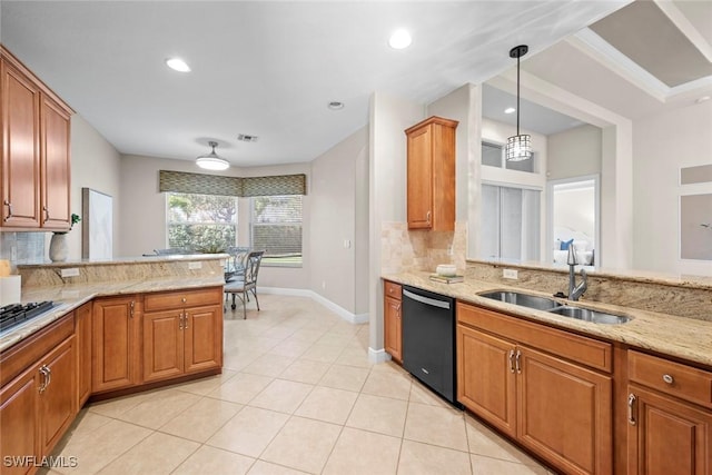 kitchen with light stone counters, a sink, dishwasher, tasteful backsplash, and pendant lighting