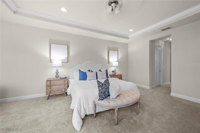 carpeted bedroom with a tray ceiling, crown molding, recessed lighting, visible vents, and baseboards