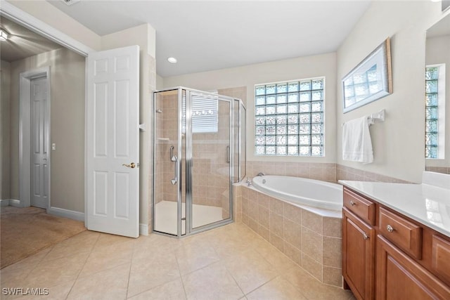 full bath with a bath, a shower stall, tile patterned flooring, and vanity