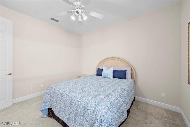 carpeted bedroom with ceiling fan, visible vents, and baseboards