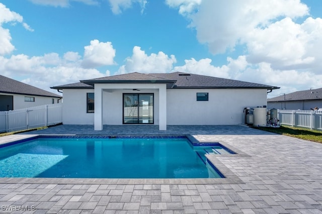 view of pool with ceiling fan and a patio