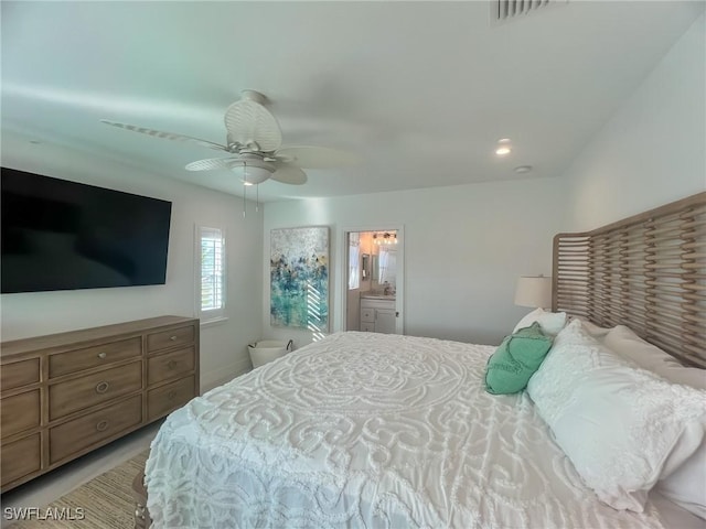 bedroom with ensuite bathroom and ceiling fan