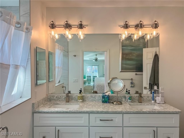 bathroom with ceiling fan and vanity