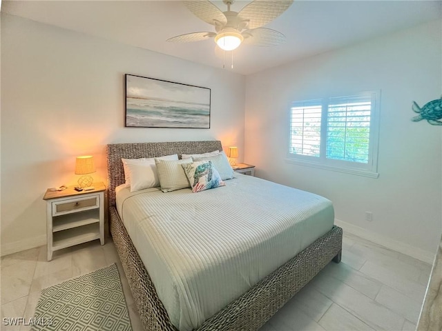 tiled bedroom featuring ceiling fan