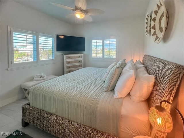 bedroom featuring light carpet and ceiling fan