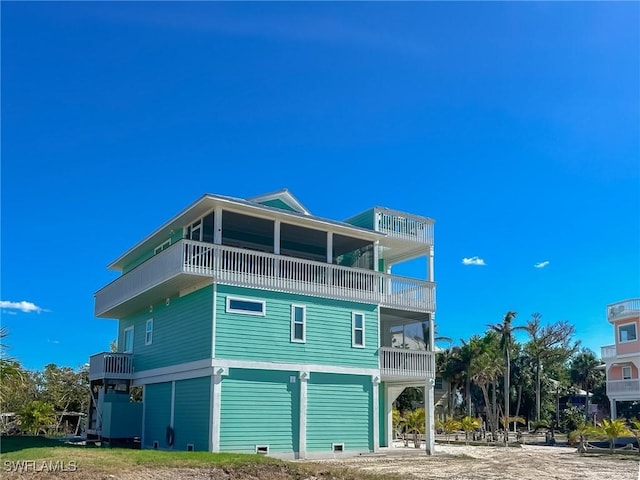 back of property with a balcony