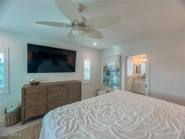 bedroom featuring ensuite bath and ceiling fan