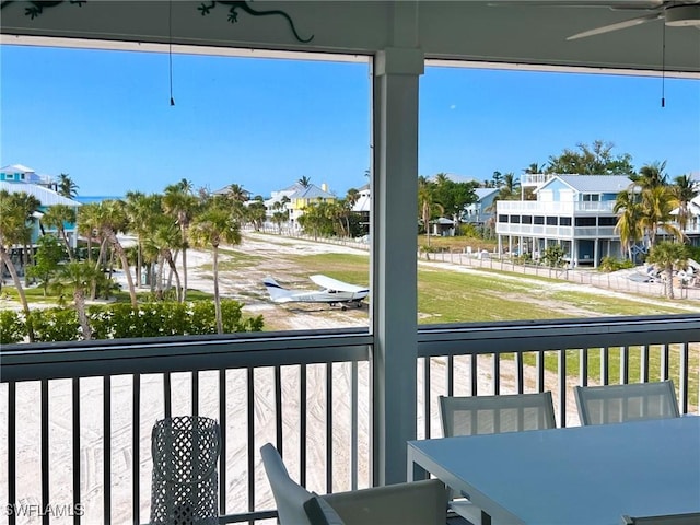 exterior space featuring ceiling fan and a healthy amount of sunlight