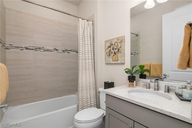 full bathroom with vanity, toilet, and shower / bath combo with shower curtain