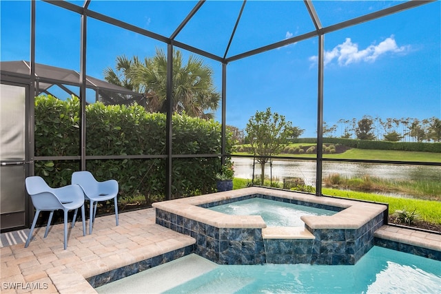 view of swimming pool featuring glass enclosure, a patio area, a water view, and an in ground hot tub