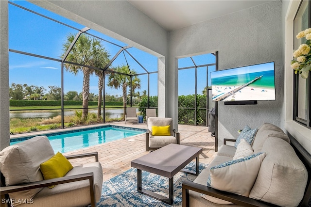 view of swimming pool with outdoor lounge area, a patio area, and glass enclosure