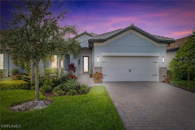 view of front of property with a garage