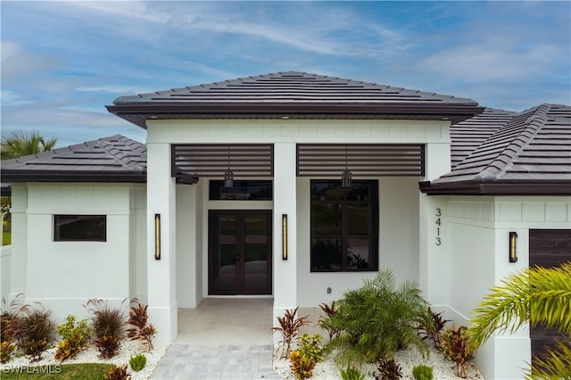 back of house featuring french doors