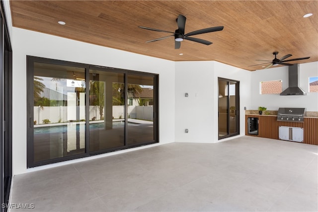 view of patio with grilling area, ceiling fan, and beverage cooler