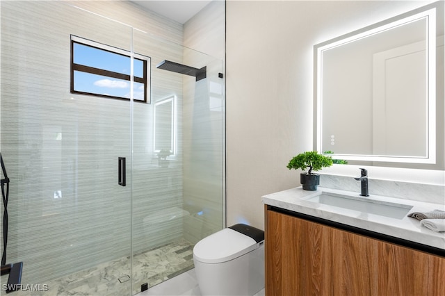 bathroom featuring vanity, an enclosed shower, and toilet