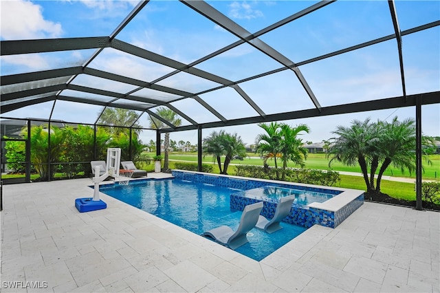 view of pool with pool water feature, a lanai, an in ground hot tub, and a patio