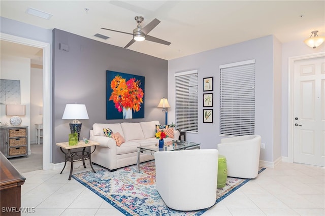 living room featuring ceiling fan and light tile patterned flooring