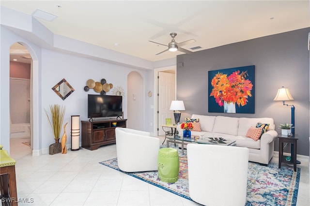 tiled living room featuring ceiling fan