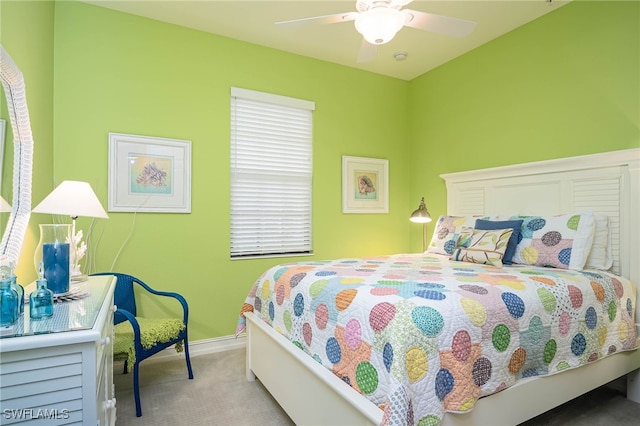 bedroom with ceiling fan and light colored carpet