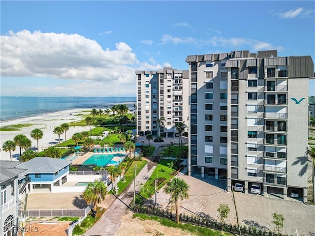 view of property featuring a water view and a view of the beach