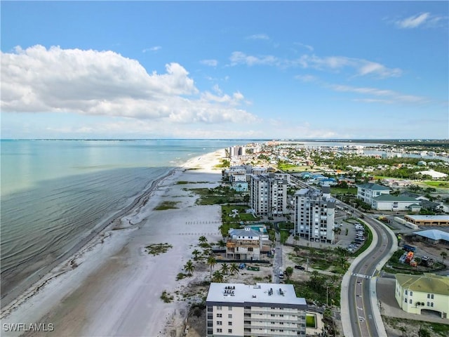 bird's eye view featuring a water view and a beach view