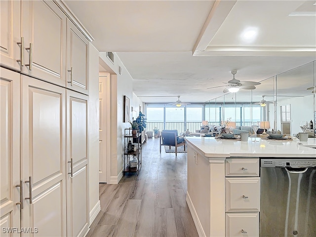 kitchen with ceiling fan, light hardwood / wood-style flooring, dishwasher, and expansive windows