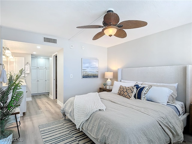 bedroom with ceiling fan and light hardwood / wood-style flooring