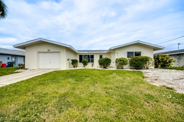 ranch-style home with a garage and a front yard