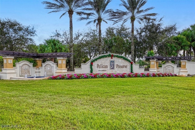 community / neighborhood sign with a lawn