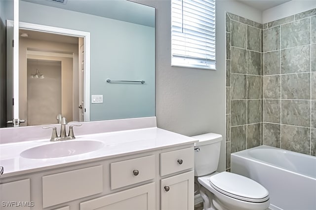 full bathroom with vanity, toilet, and  shower combination