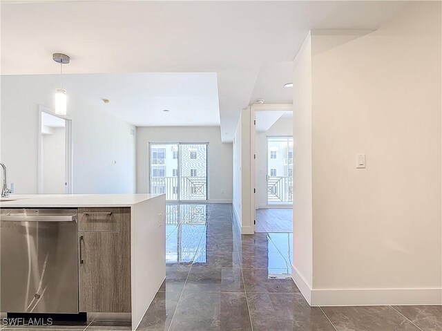 kitchen featuring pendant lighting and stainless steel dishwasher