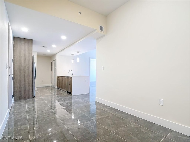 spare room featuring sink