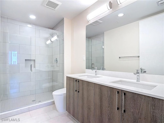 bathroom with vanity, an enclosed shower, tile patterned floors, and toilet