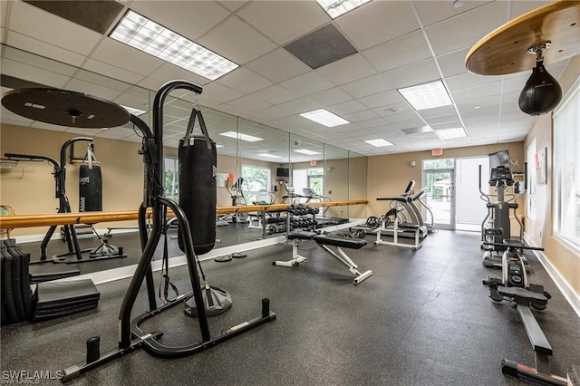 gym featuring a drop ceiling