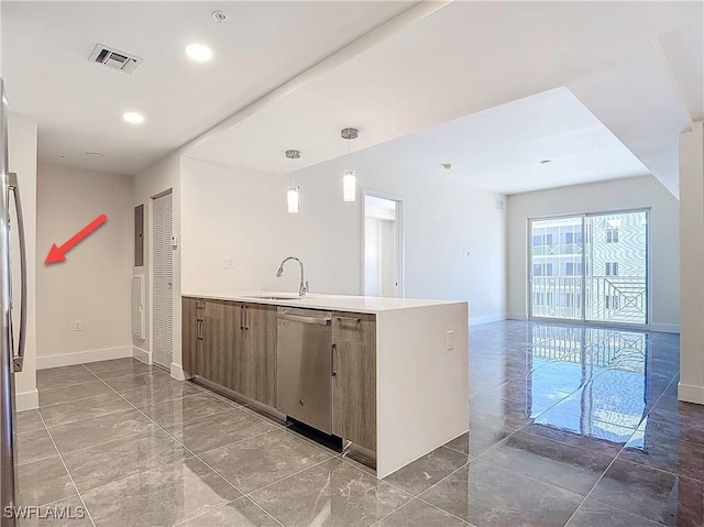 kitchen with sink, decorative light fixtures, and stainless steel dishwasher