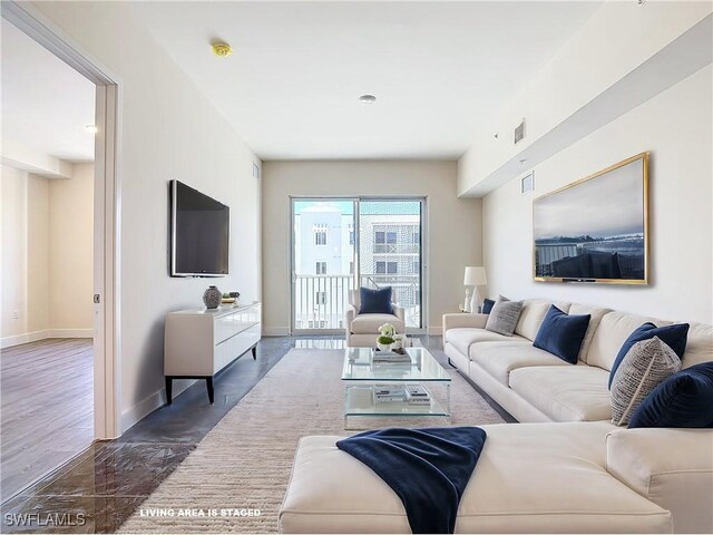 living room with dark hardwood / wood-style flooring