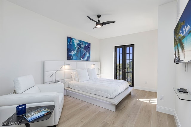 bedroom featuring ceiling fan, french doors, and light hardwood / wood-style floors