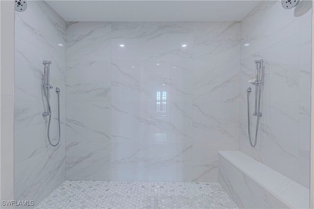 bathroom featuring tiled shower